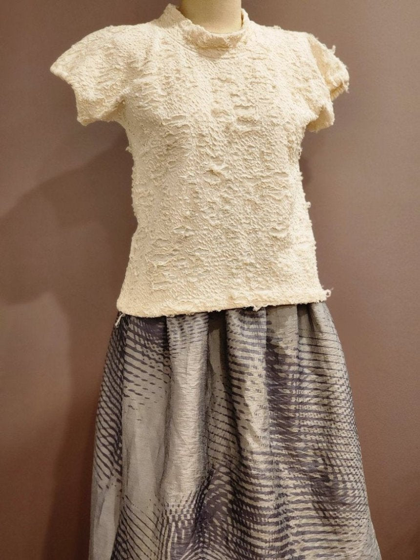 Zero Waste Skirt Gathered Abstract on mannequin in blue and grey with abstract wave pattern lined with organic cotton lining with The Jade Top in cream with shredded cotton finished over the op and un tucked