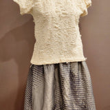 Zero Waste Skirt Gathered Abstract on mannequin in blue and grey with abstract wave pattern lined with organic cotton lining with The Jade Top in cream with shredded cotton finished over the op and un tucked