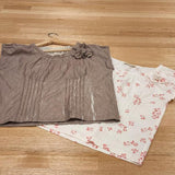 We can see the by Audrey and Grace Zero waste tops in Antique and Hydrangea lying flat on a wooden table.  The Antique coloured top is slightly covering the floral zero waste top