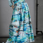 Close up of model in full-length Ocean Skirt with Preston Zly winter boots and knit jumper