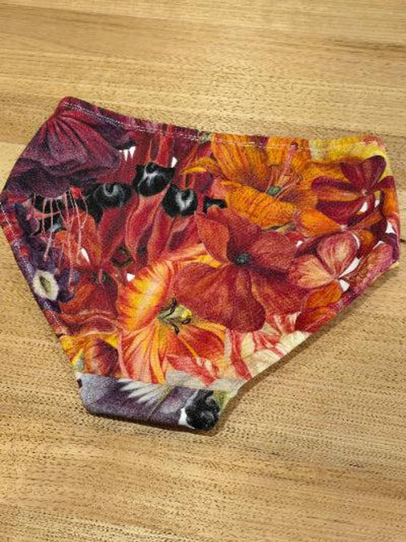 Australian made womens underwear the Big Girls Briefs in the Big Bloom print face down showing Sturts desert pea, Lillies and other beautiful blooms