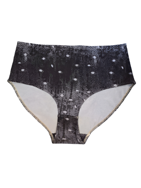 A flat lay of the front of the Night Snow Big Girls briefs on a white background, showing a transitioning black to grey mottled print with white dots that look like large snow flakes, covering the print