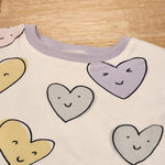 Kids puff sleeve tee in Smiley Hearts print, organic cotton Close Up