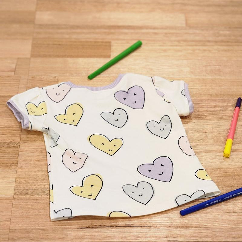 Kids puff sleeve tee in Smiley Hearts print, organic cotton front 2