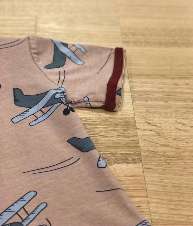 Kids raw edge tee in Aeroplanes print, organic cotton close up of sleeve detail