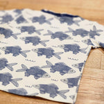 Kids raw edge tee in Fish print, organic cotton — back flat lay