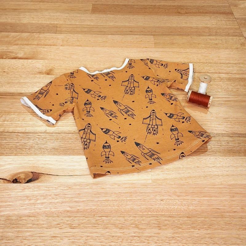Kids raw edge tee in Rockets print, organic cotton — back flat lay