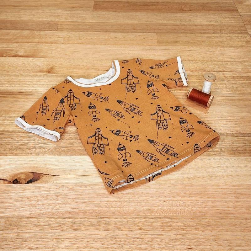 Kids raw edge tee in Rockets print, organic cotton — front flat lay