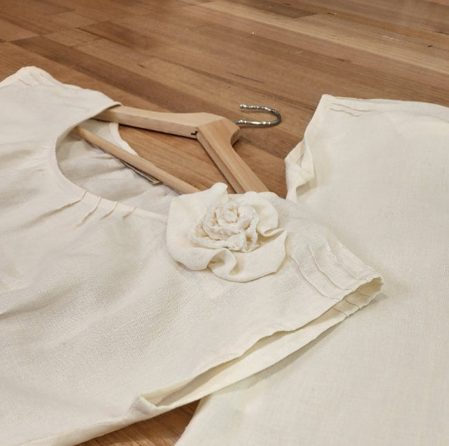 by Audrey & Grace Linen Zero Waste Top in Oyster colour, showing detail of the rosette and pin tucks near shoulder
