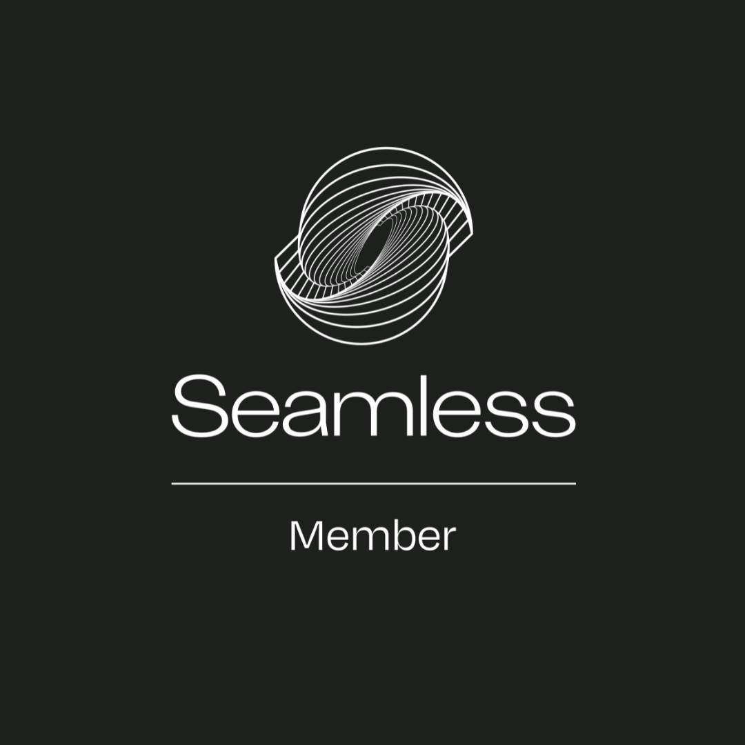 A black square with a white logo which shows a stylised outline of Australia with smooth, interconnected lines, representing technology and connectivity along with the word Seamless underlined and below this the word Member