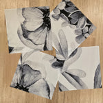 The Floriferous Hankies in 4 of the 5 print options scattered on a wooden table top