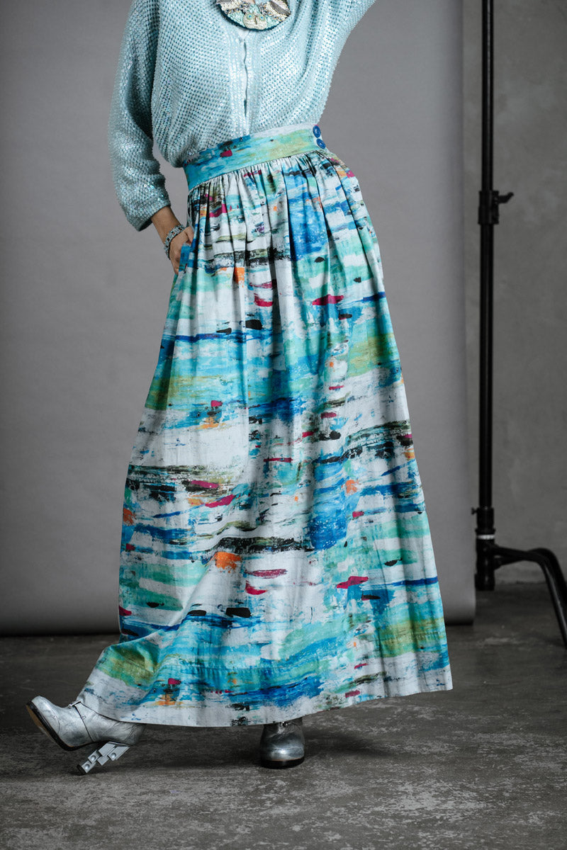 Close up of model in full-length Ocean Skirt with Preston Zly winter boots and knit jumper