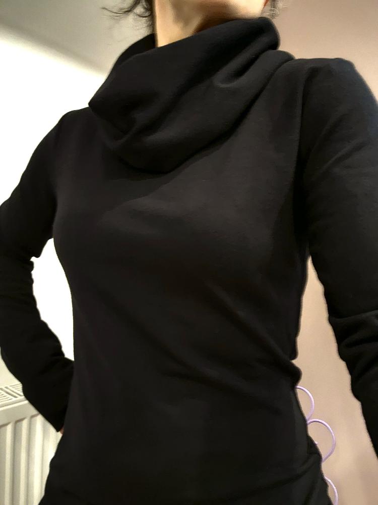 The Black Ruby Jumper with cowl turtleneck, worn by model . Showing a close fitting piece of Australian made womens clothing, accredited by Ethical Clothing Australia.