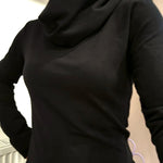 The Black Ruby Jumper with cowl turtleneck, worn by model . Showing a close fitting piece of Australian made womens clothing, accredited by Ethical Clothing Australia.