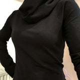 The Black Ruby Jumper with cowl turtleneck, worn by model . Showing a close fitting piece of Australian made womens clothing, accredited by Ethical Clothing Australia.
