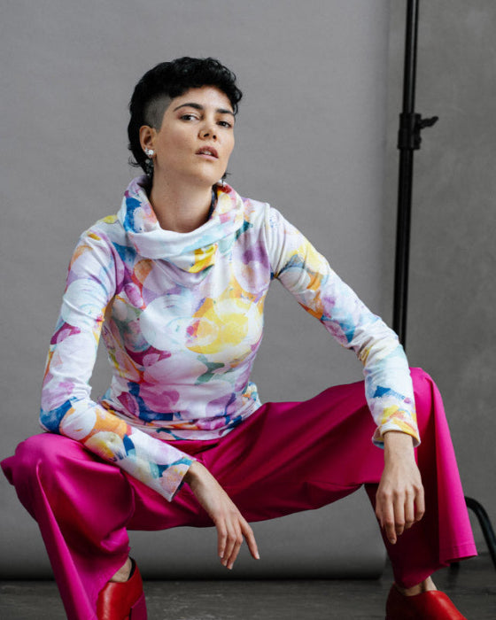 The Ruby Jumper in Bubbles print - sustainable Australian made women's jumper in vibrant watercolour design for dopamine dressing, styled with magenta trousers cropped