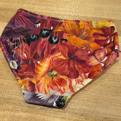 Australian made womens underwear the Big Girls Briefs in the Big Bloom print face down showing Sturts desert pea, Lillies and other beautiful blooms