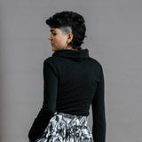 The Ruby Jumper in Black, Australian Women's Jumpers made from Australian cotton — Back facing with left hand in hidden large pocket