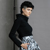 The Ruby Jumper in Black, Australian Women's Jumpers made from Australian cotton — Side on with hands in large hidden side pockets