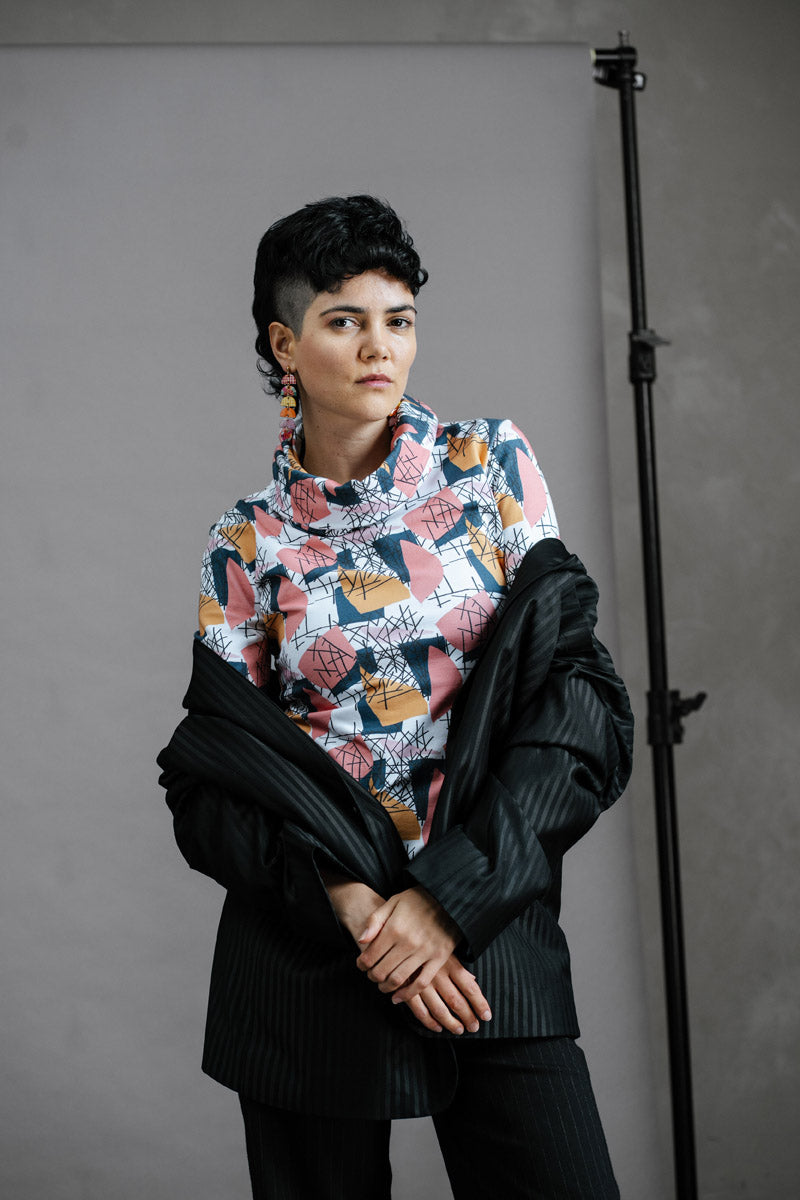 The Ruby Jumper Jumble Print, with large cowl neck, Australian Women's Jumpers made from Australian cotton — Front facing wearing oversized black suit jacket sliding off shoulders